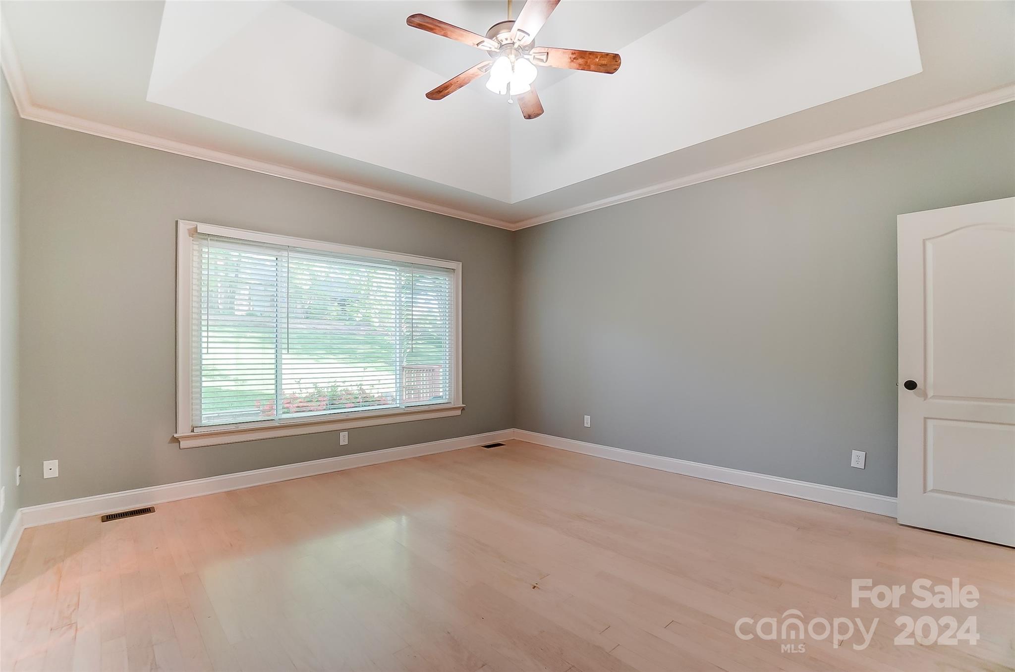 657 Portpatrick Place Fort Mill, SC 29708 - Photo 21 of 46 an empty room with windows and fan