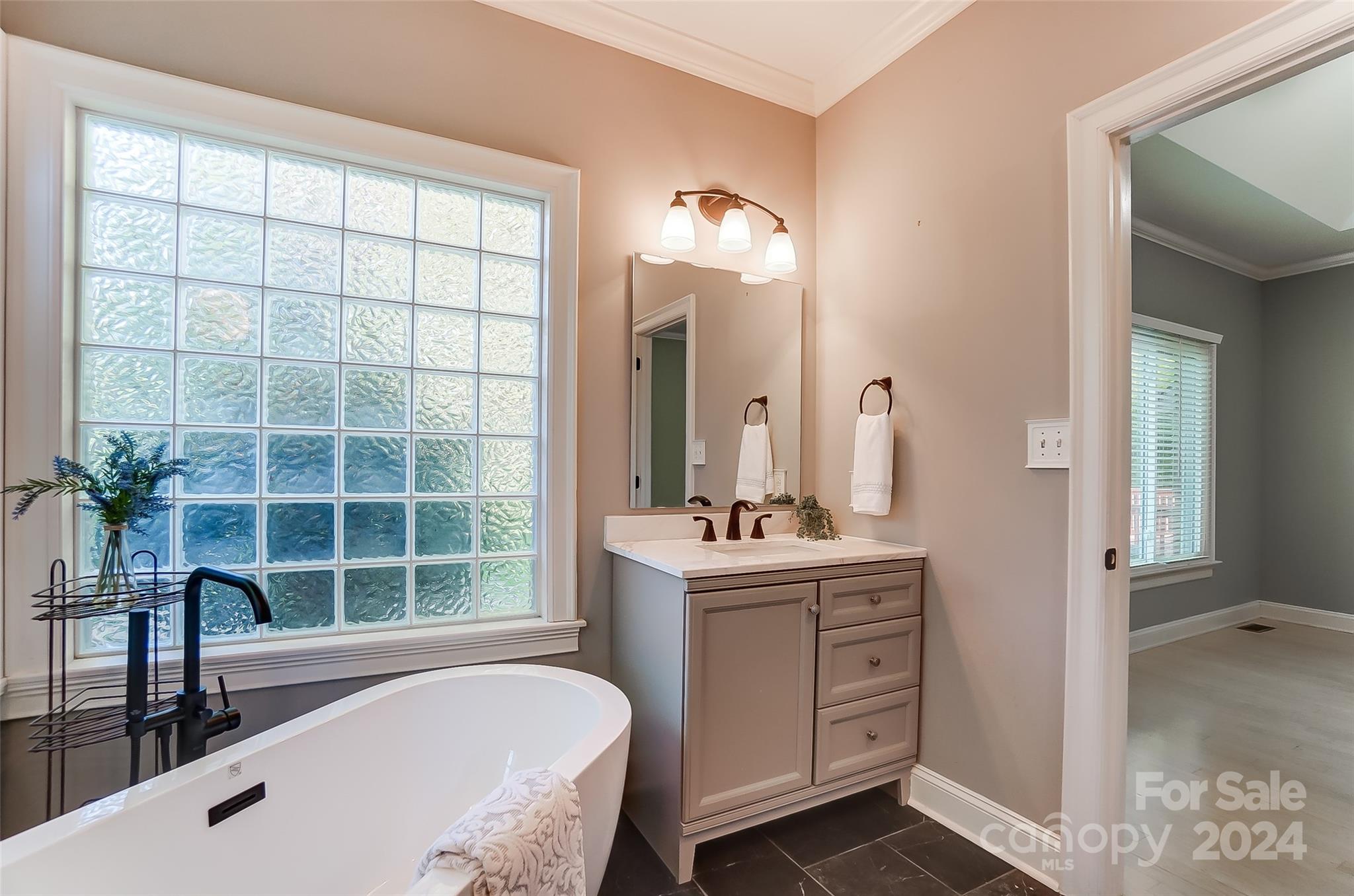 657 Portpatrick Place Fort Mill, SC 29708 - Photo 23 of 46 a bathroom with a tub sink and mirror
