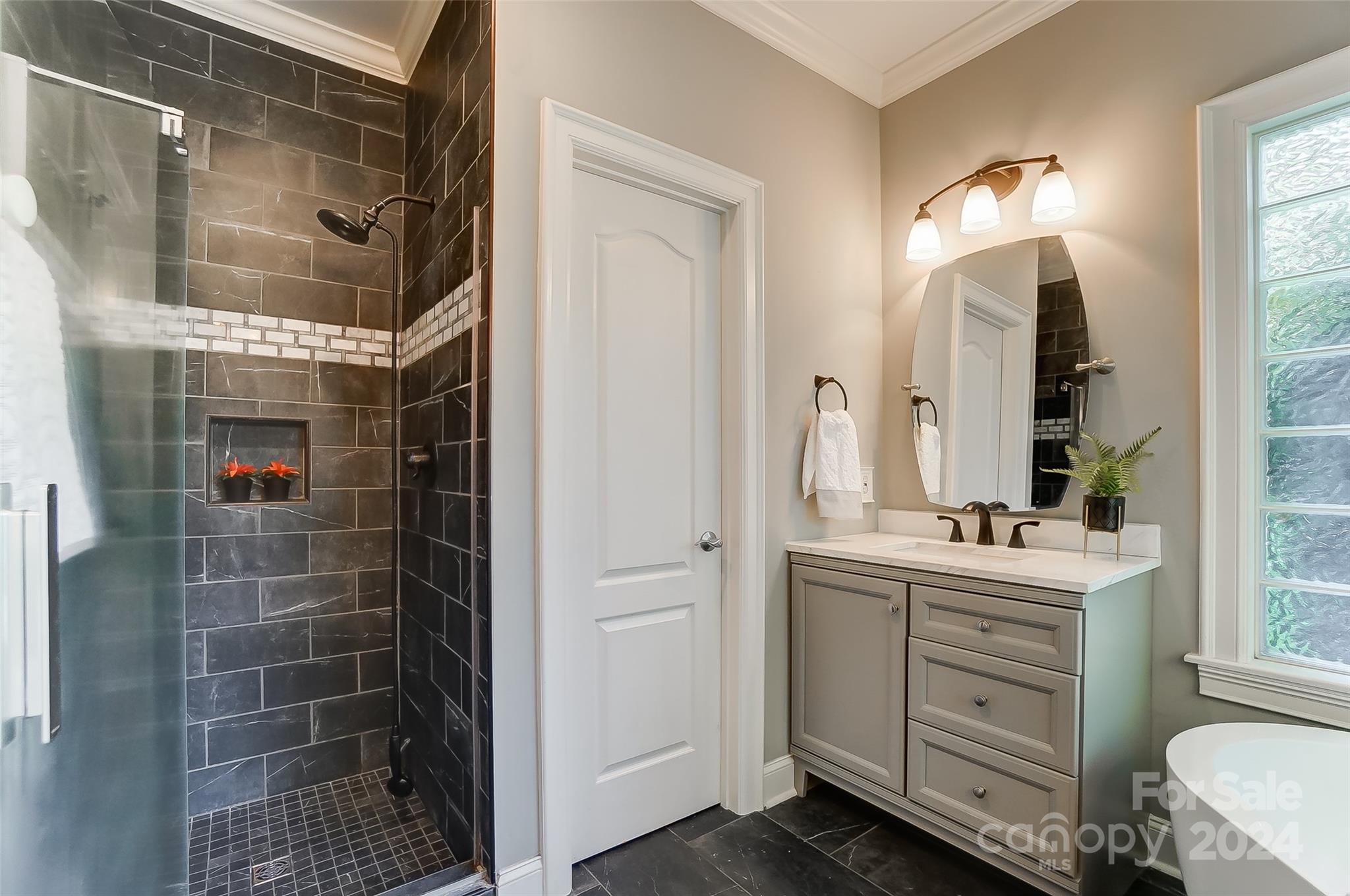 657 Portpatrick Place Fort Mill, SC 29708 - Photo 25 of 46 a bathroom with a double vanity sink a toilet and shower