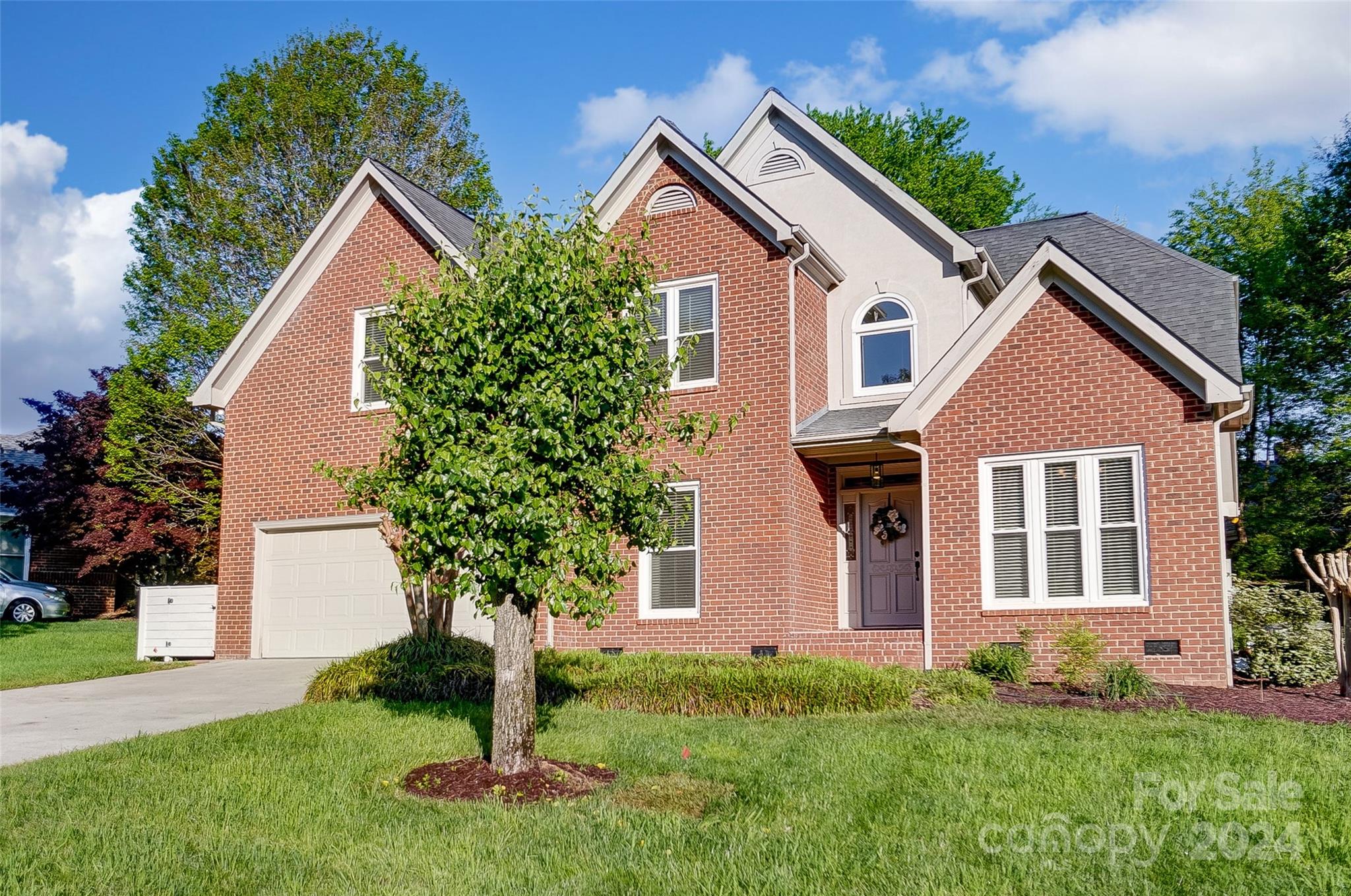 657 Portpatrick Place Fort Mill, SC 29708 - Photo 3 of 46 a front view of a house with a yard and trees