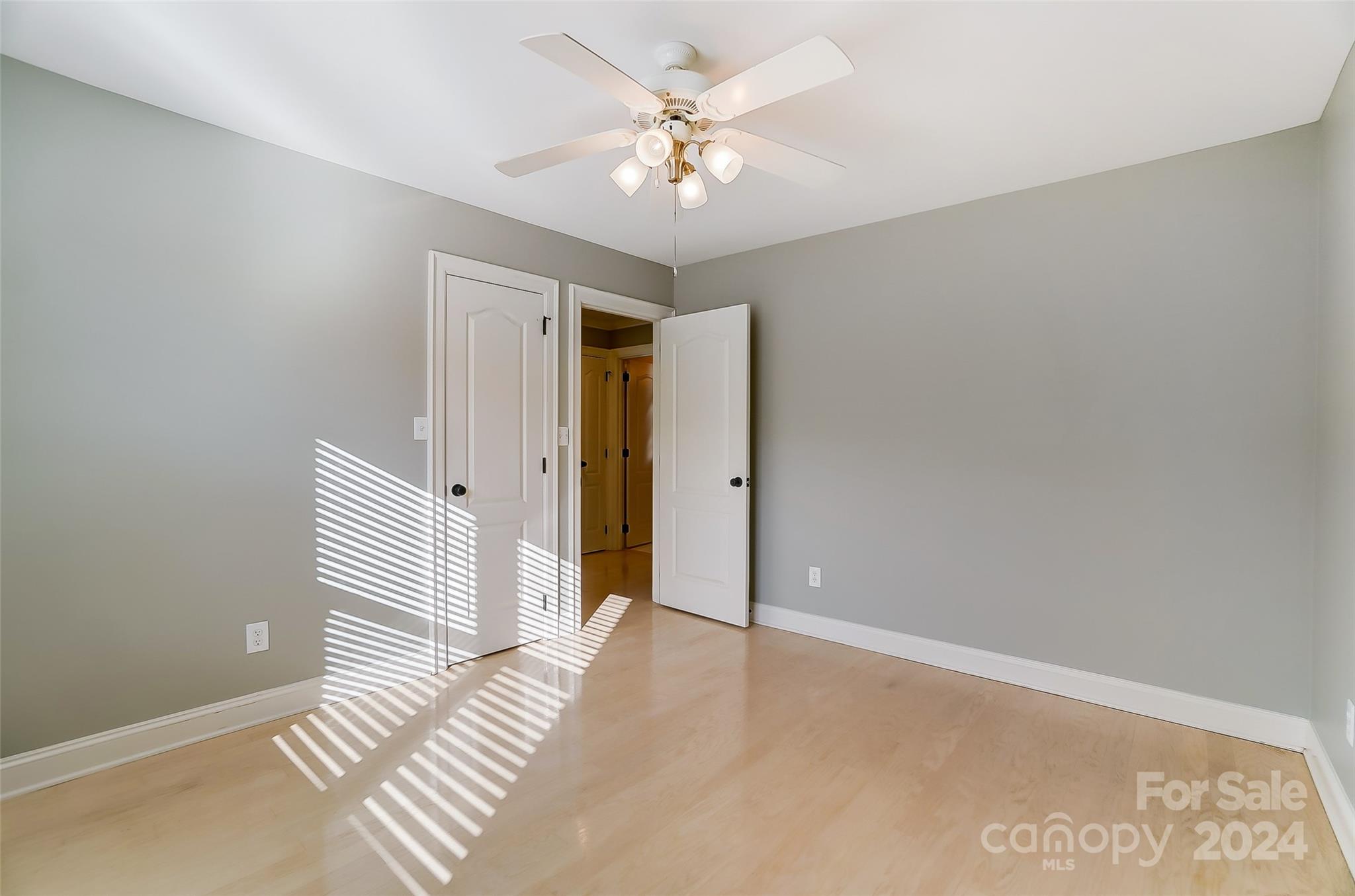 657 Portpatrick Place Fort Mill, SC 29708 - Photo 31 of 46 a view of a livingroom with a chandelier fan and windows