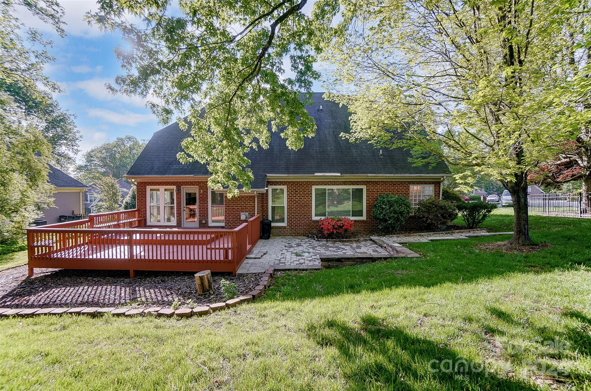 657 Portpatrick Place Fort Mill, SC 29708 - Photo 39 of 46 a front view of a house with a garden and trees