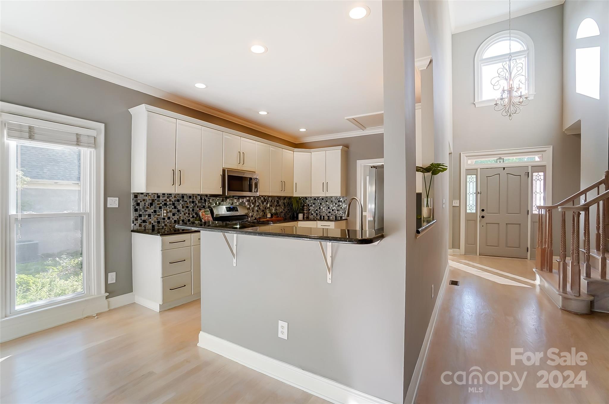 657 Portpatrick Place Fort Mill, SC 29708 - Photo 10 of 46 a kitchen with stainless steel appliances a refrigerator and a stove top oven