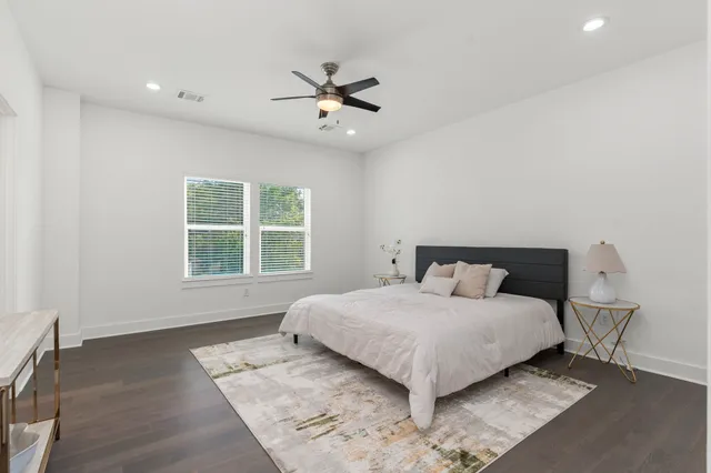 a bedroom with a bed and window