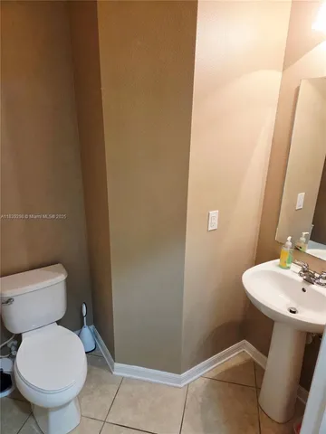 a view of a kitchen with a sink and cabinets