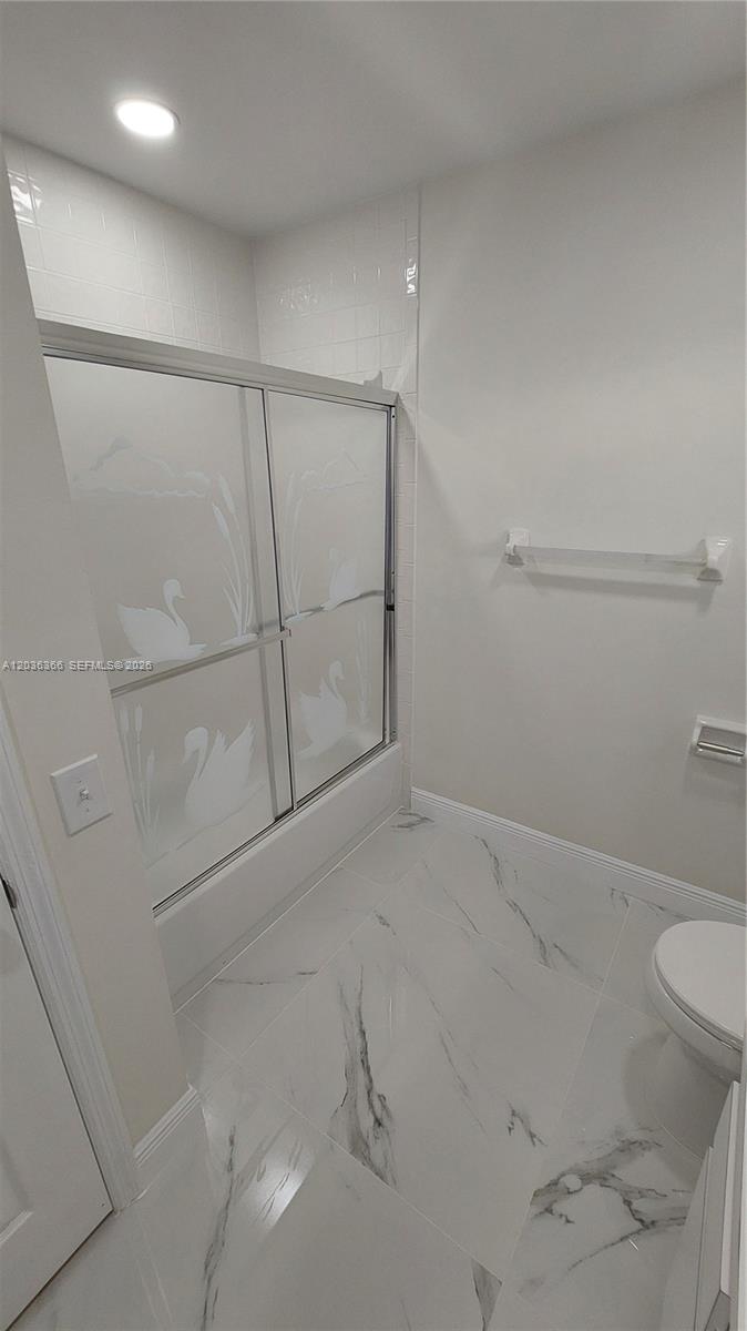 7083 Southwest 158th Court Miami, FL 33193 - Photo 16 of 22 a bathroom with a shower and toilet