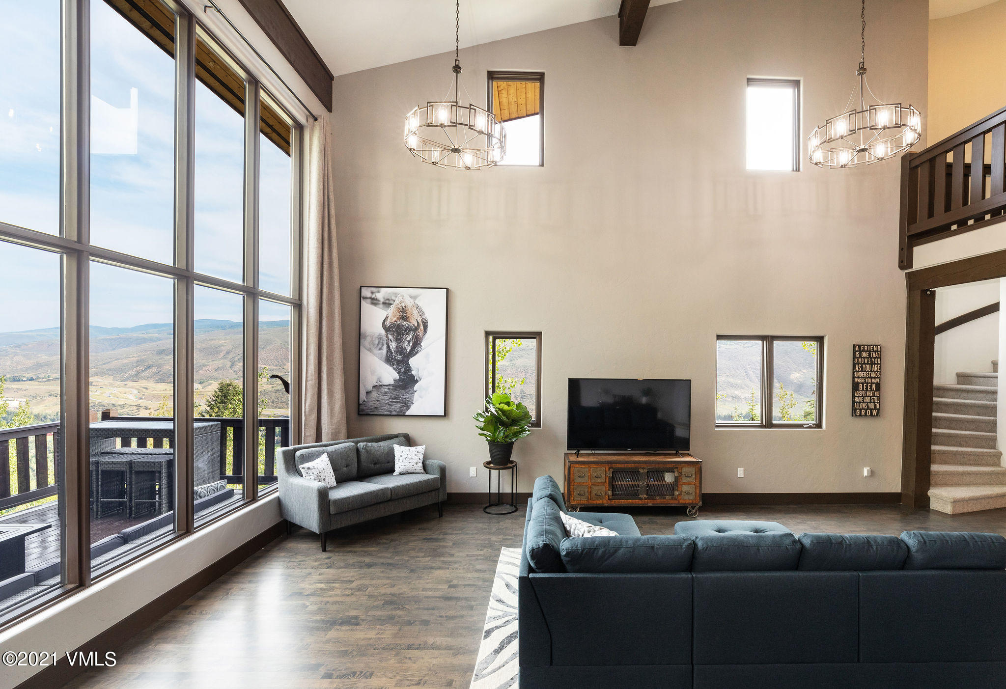 1074 Eagle Drive Eagle-Vail, CO 81620 - Photo 1 of 30 a living room with furniture and a flat screen tv