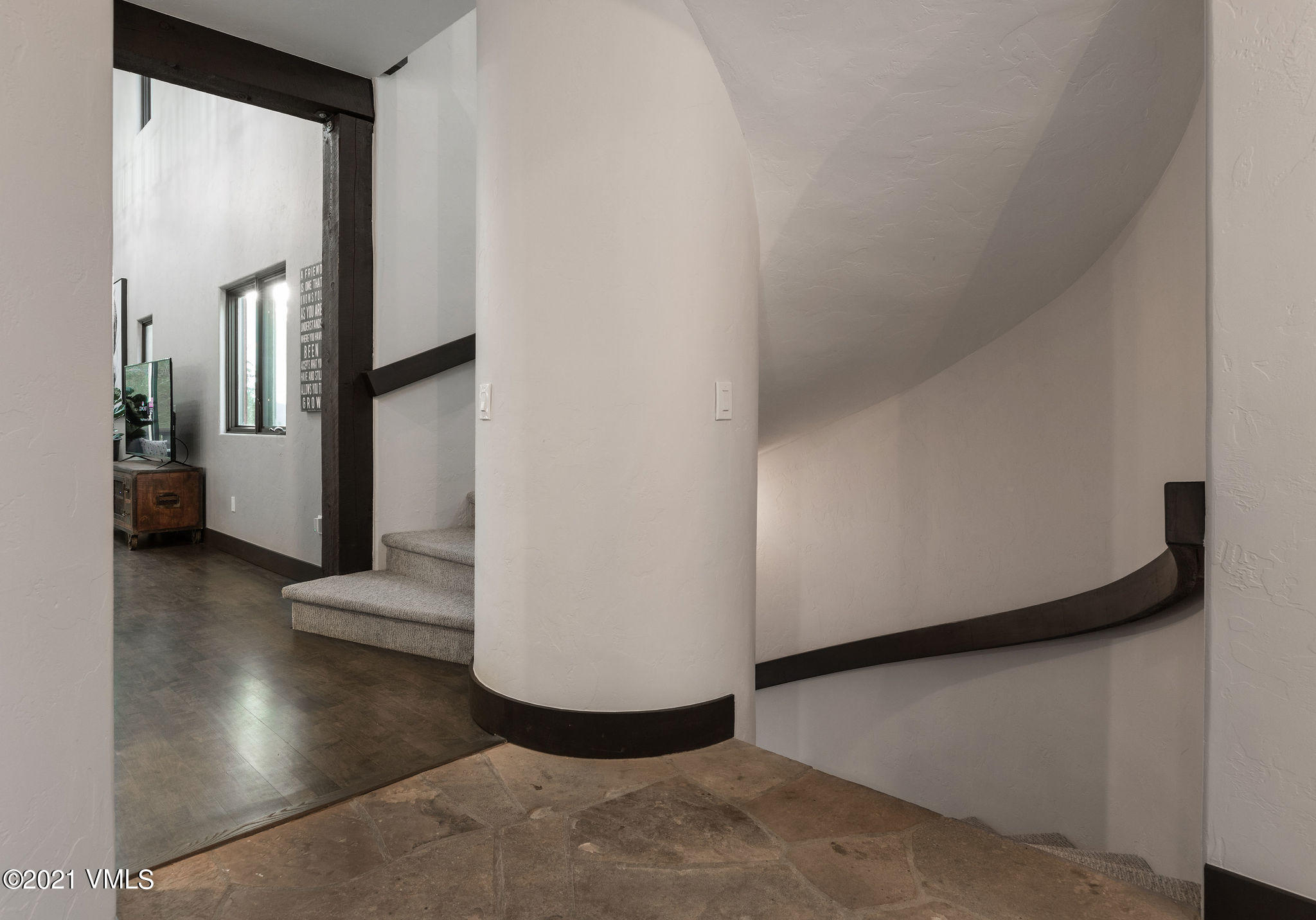 1074 Eagle Drive Eagle-Vail, CO 81620 - Photo 15 of 30 a view of a hallway to room with wooden floor