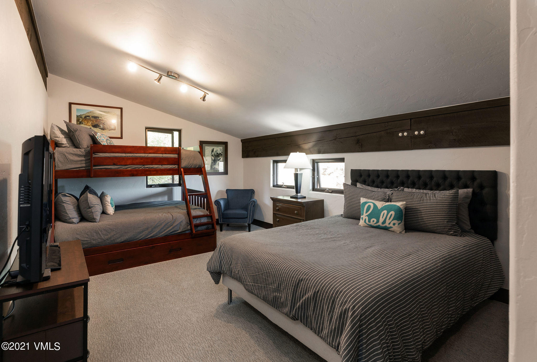 1074 Eagle Drive Eagle-Vail, CO 81620 - Photo 20 of 30 a bedroom with double bed and a couch