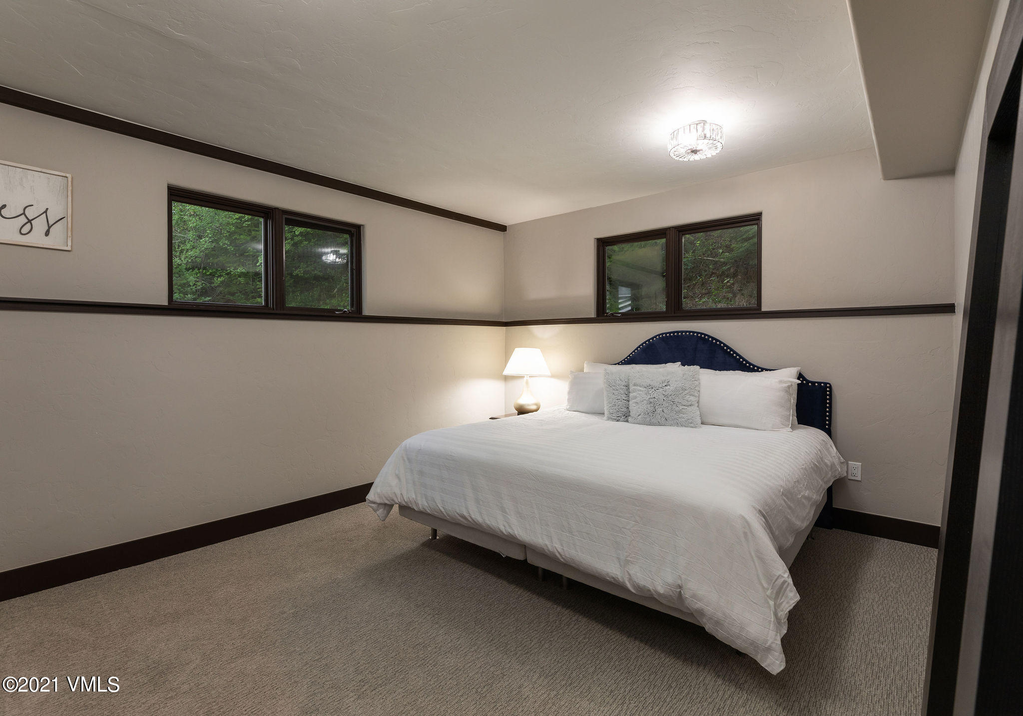 1074 Eagle Drive Eagle-Vail, CO 81620 - Photo 23 of 30 a bedroom with a bed and a window