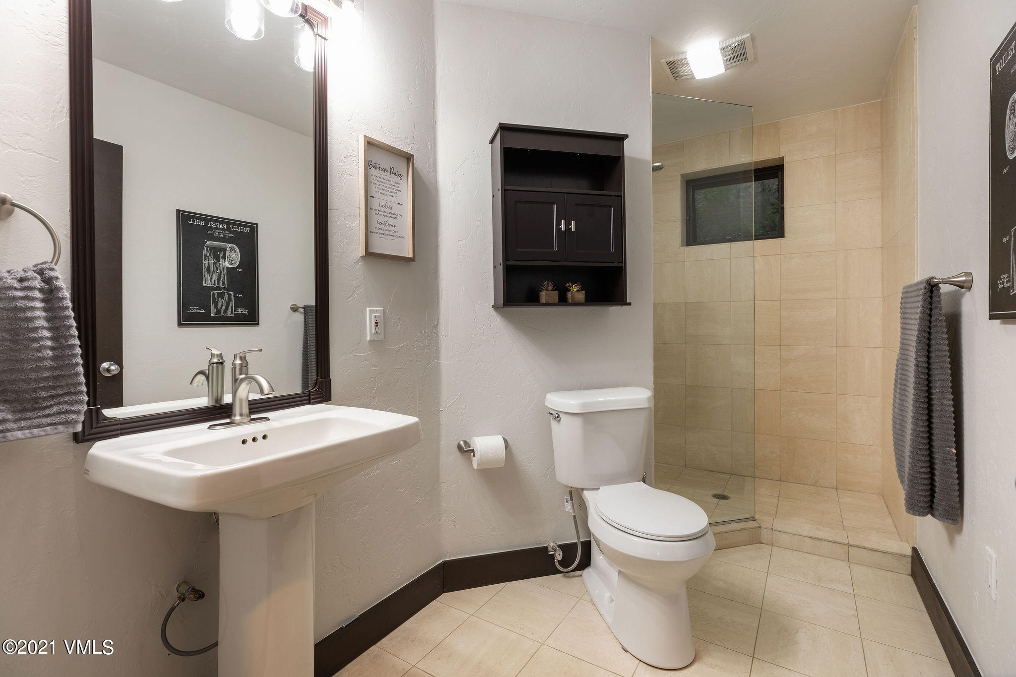 1074 Eagle Drive Eagle-Vail, CO 81620 - Photo 24 of 30 a bathroom with a sink toilet and shower