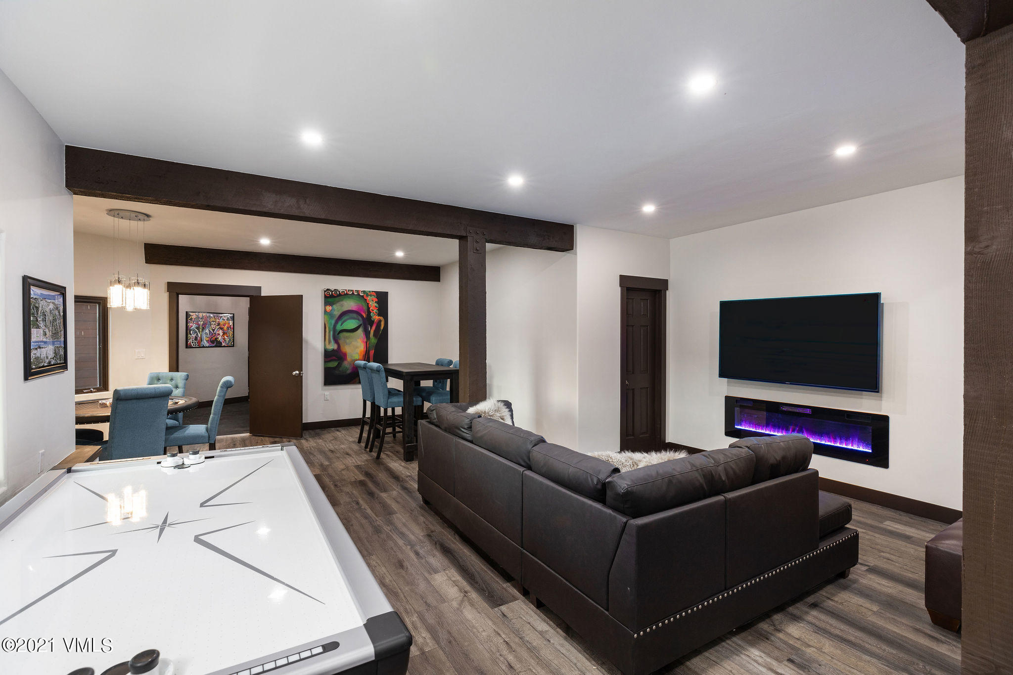1074 Eagle Drive Eagle-Vail, CO 81620 - Photo 25 of 30 a living room with furniture and a flat screen tv