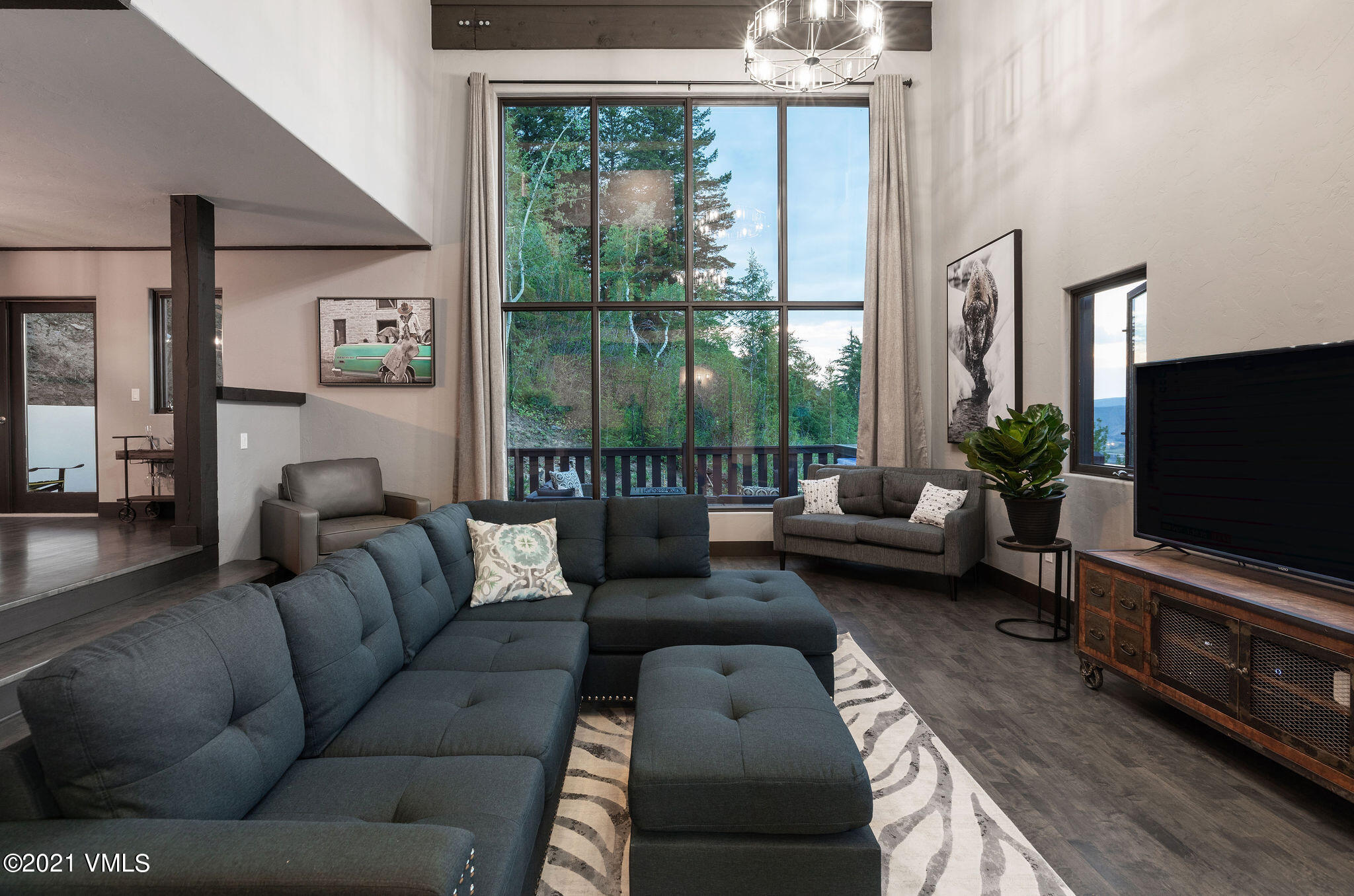 1074 Eagle Drive Eagle-Vail, CO 81620 - Photo 6 of 30 a living room with furniture and a flat screen tv