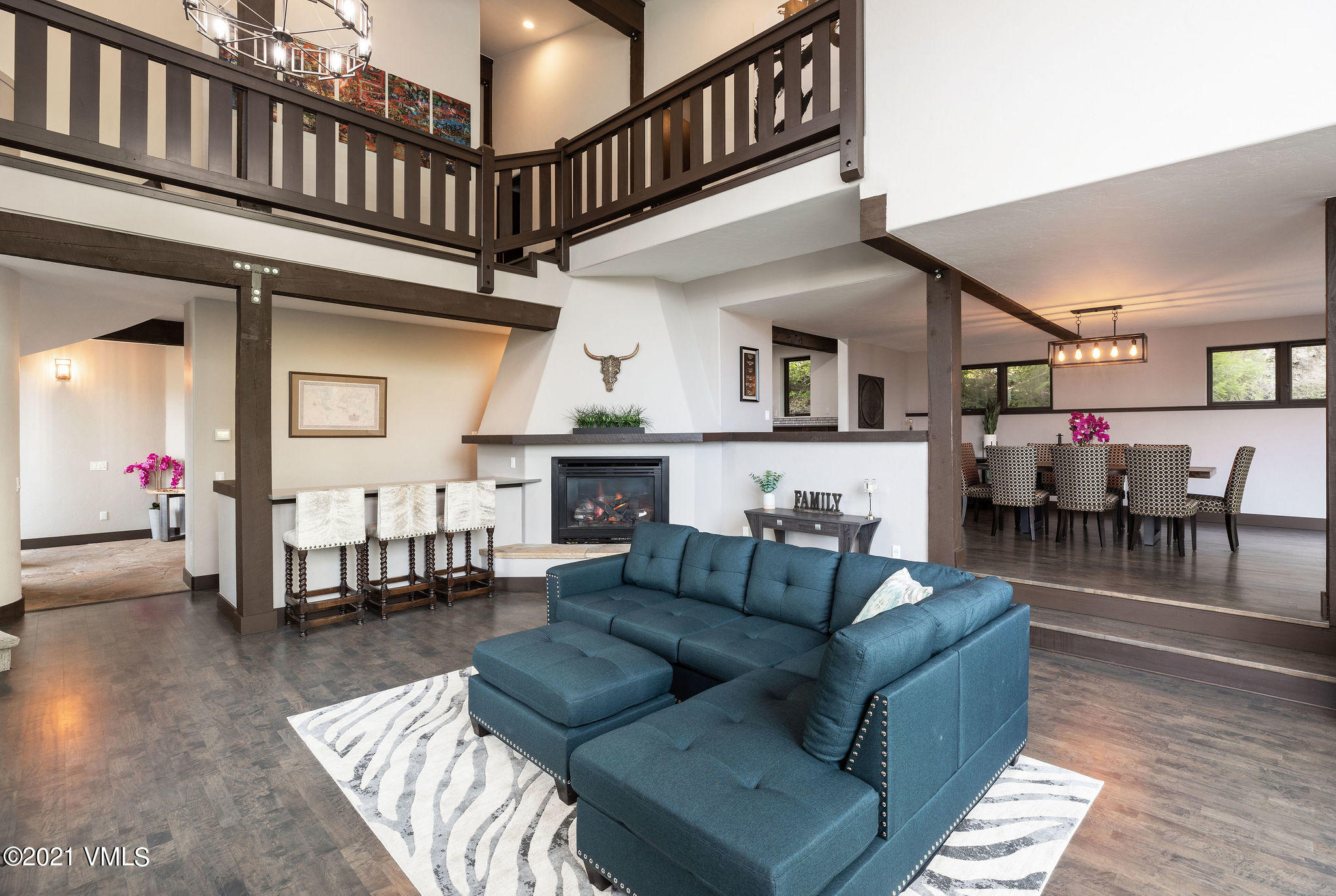 1074 Eagle Drive Eagle-Vail, CO 81620 - Photo 30 of 30 a living room with furniture a fireplace and wooden floor