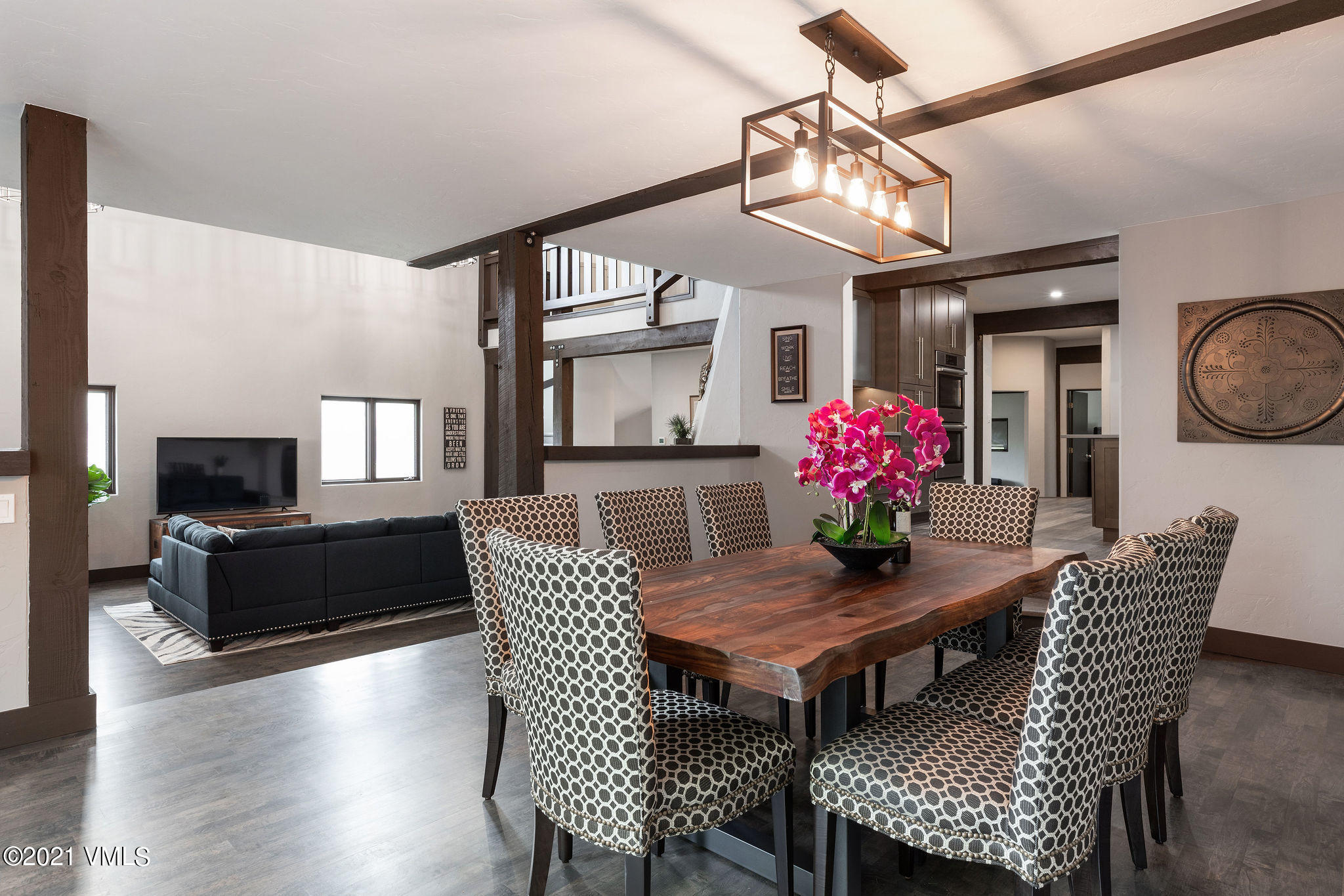1074 Eagle Drive Eagle-Vail, CO 81620 - Photo 8 of 30 a view of a dining room with furniture a chandelier and wooden floor