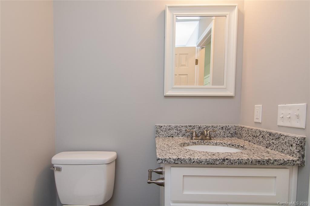 211 Anthony Road Rockwell, NC 28138 - Photo 14 of 22 a bathroom with a granite countertop toilet and sink