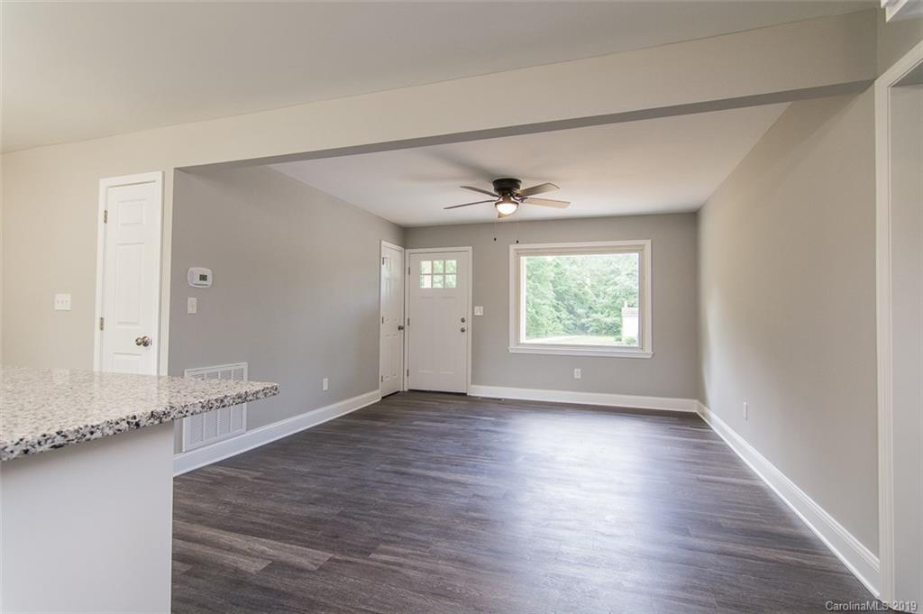 211 Anthony Road Rockwell, NC 28138 - Photo 8 of 22 wooden floor in an empty room with a window