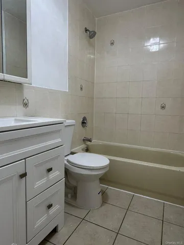 a bathroom with a toilet a sink and bathtub