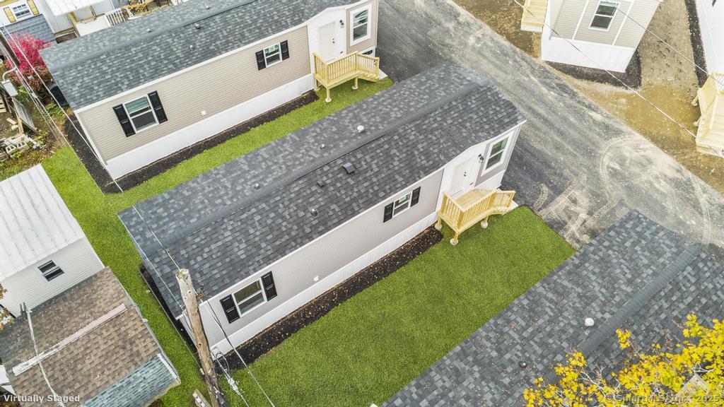 55 Sugar Street, Unit 10 Newtown, CT 06470 - Photo 1 of 18 a view of a house with a backyard