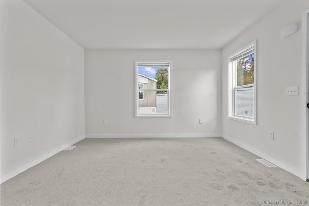 55 Sugar Street, Unit 10 Newtown, CT 06470 - Photo 15 of 18 a view of an empty room with a window