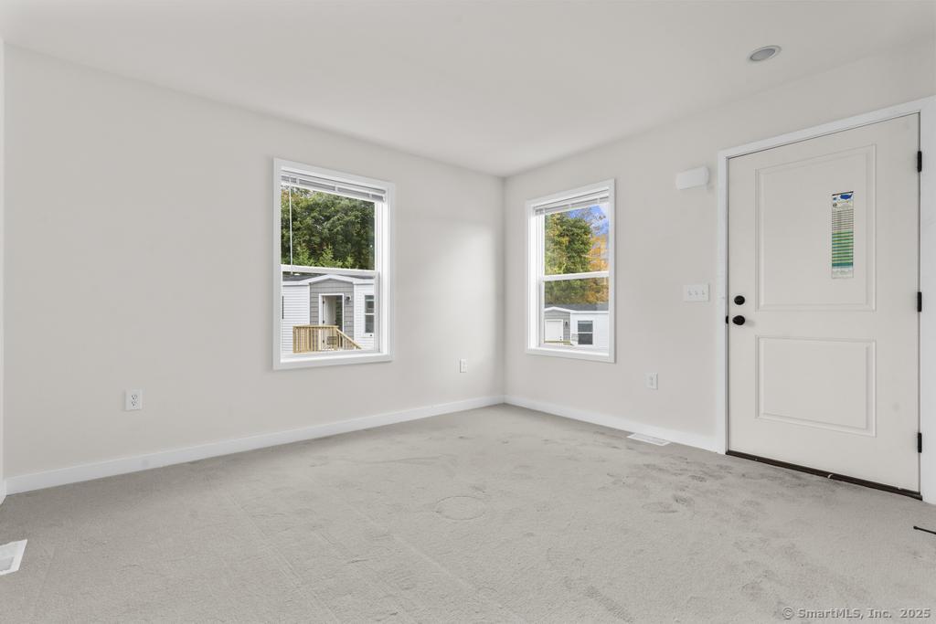 55 Sugar Street, Unit 10 Newtown, CT 06470 - Photo 16 of 18 a view of an empty room with a window