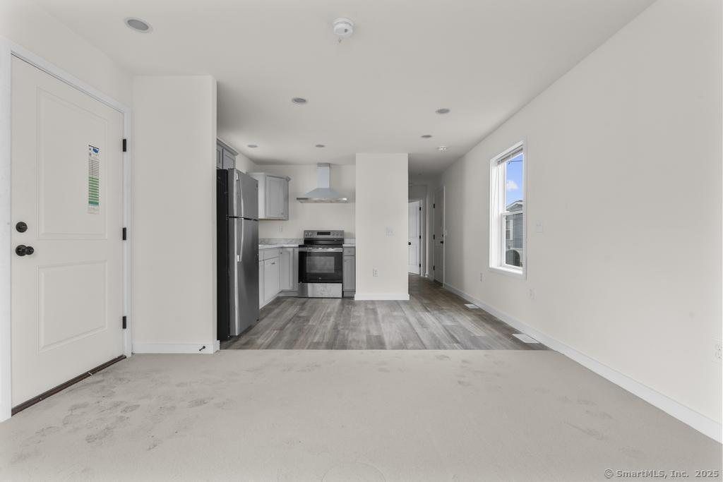 55 Sugar Street, Unit 10 Newtown, CT 06470 - Photo 7 of 18 a view of kitchen and windows
