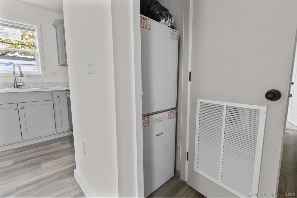 55 Sugar Street, Unit 10 Newtown, CT 06470 - Photo 9 of 18 a view of bathroom with a sink and mirror