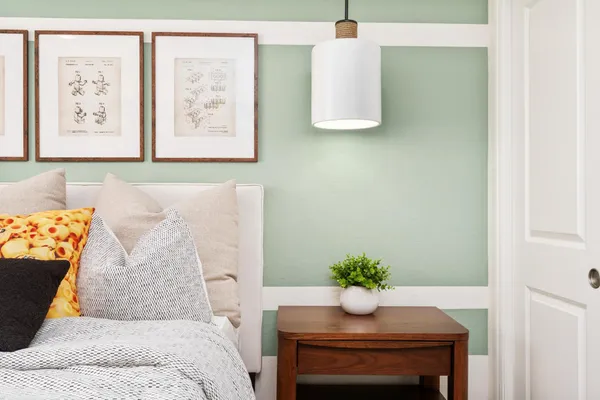 a bedroom with a bed and a dresser