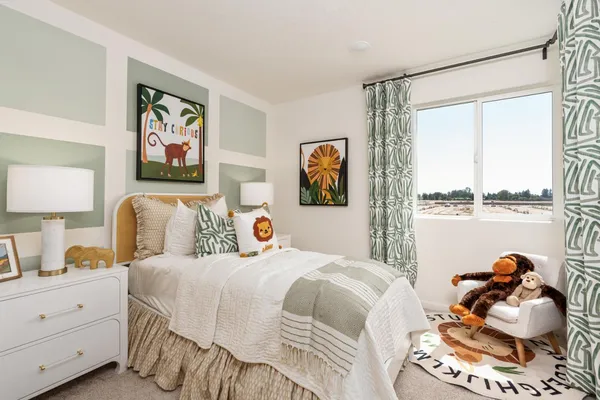 a bedroom with a bed and a couch