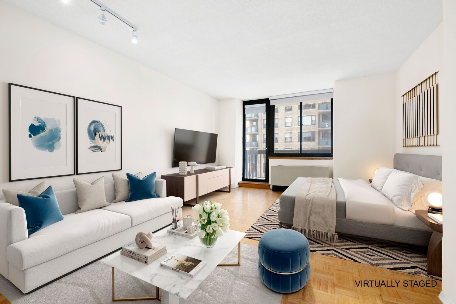 250 East 40th Street, Unit 21C Manhattan, NY 10016 - Photo 2 of 13 a living room with furniture a rug and a flat screen tv