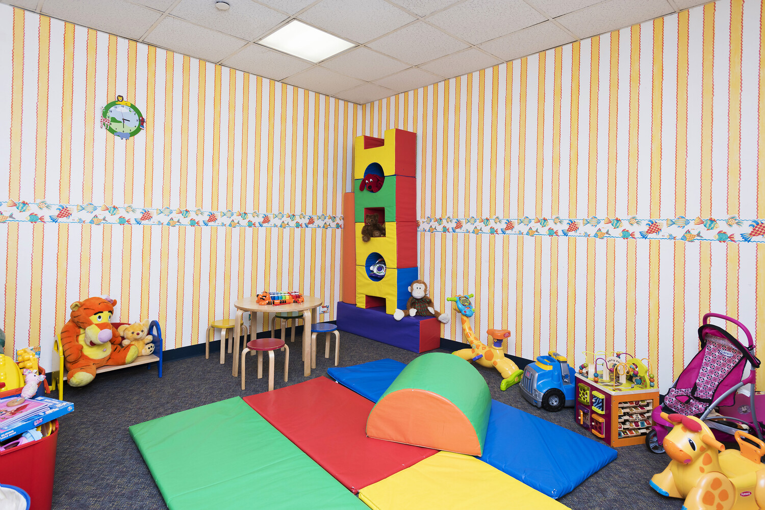 250 East 40th Street, Unit 21C Manhattan, NY 10016 - Photo 8 of 13 a view of a bedroom with furniture and toys