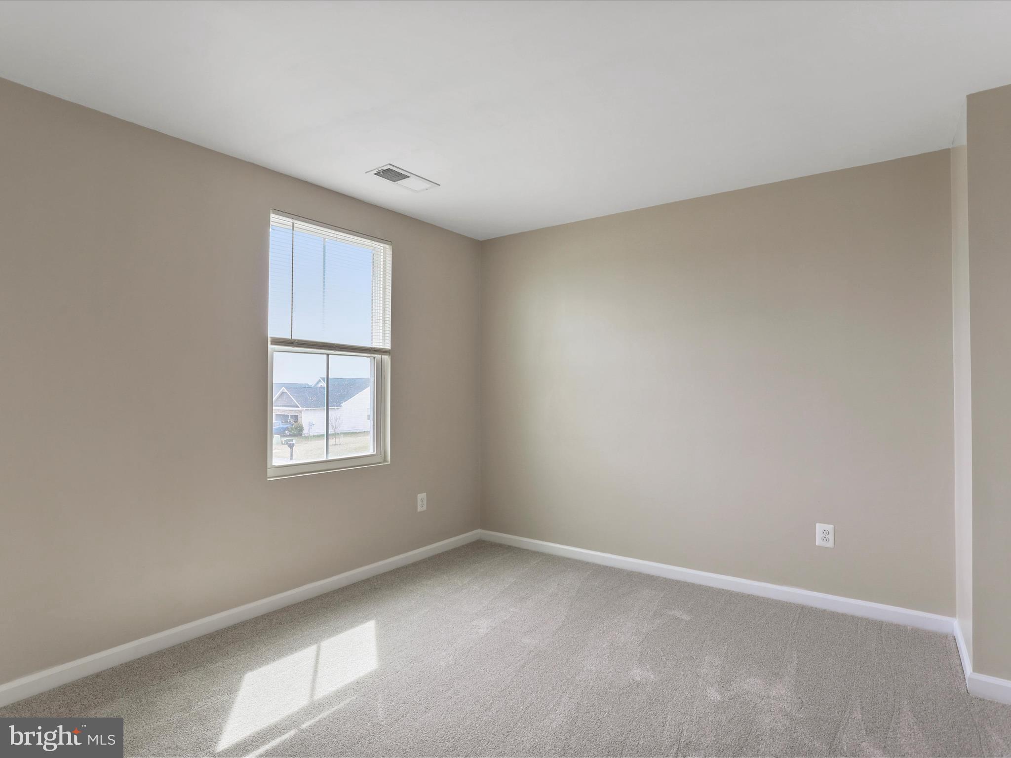 257 Switchgrass Court Bunker Hill, WV 25413 - Photo 12 of 26 an empty room with a window