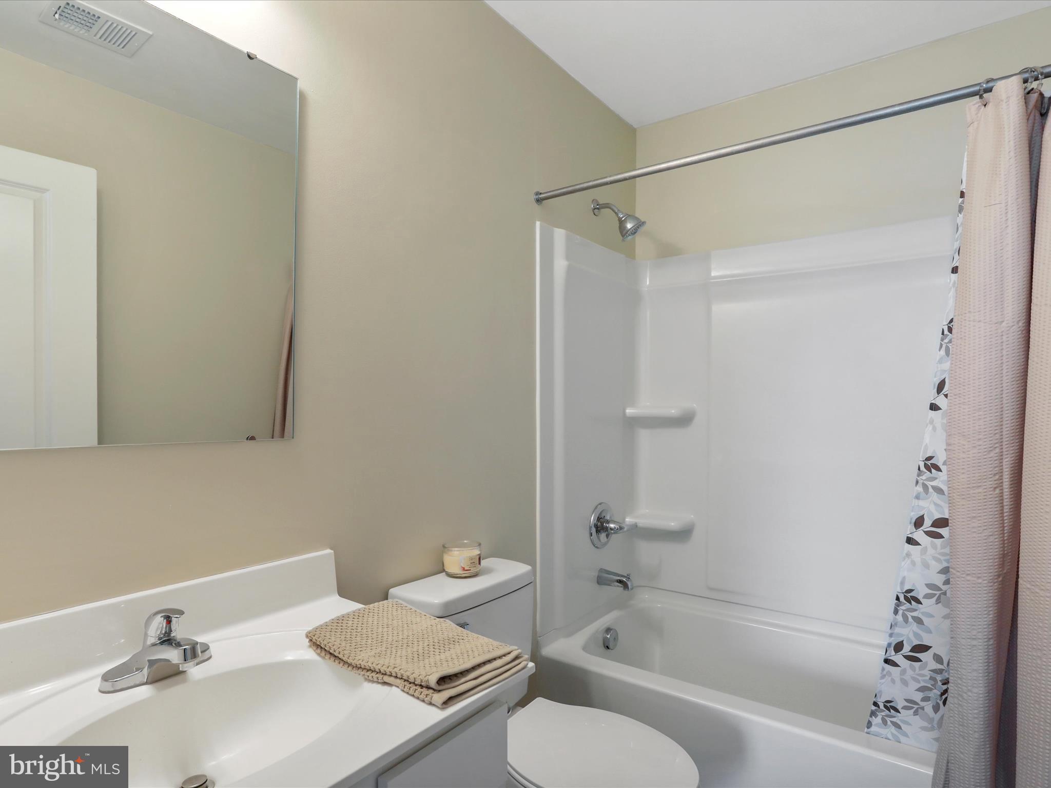 257 Switchgrass Court Bunker Hill, WV 25413 - Photo 14 of 26 a bathroom with a sink toilet and shower