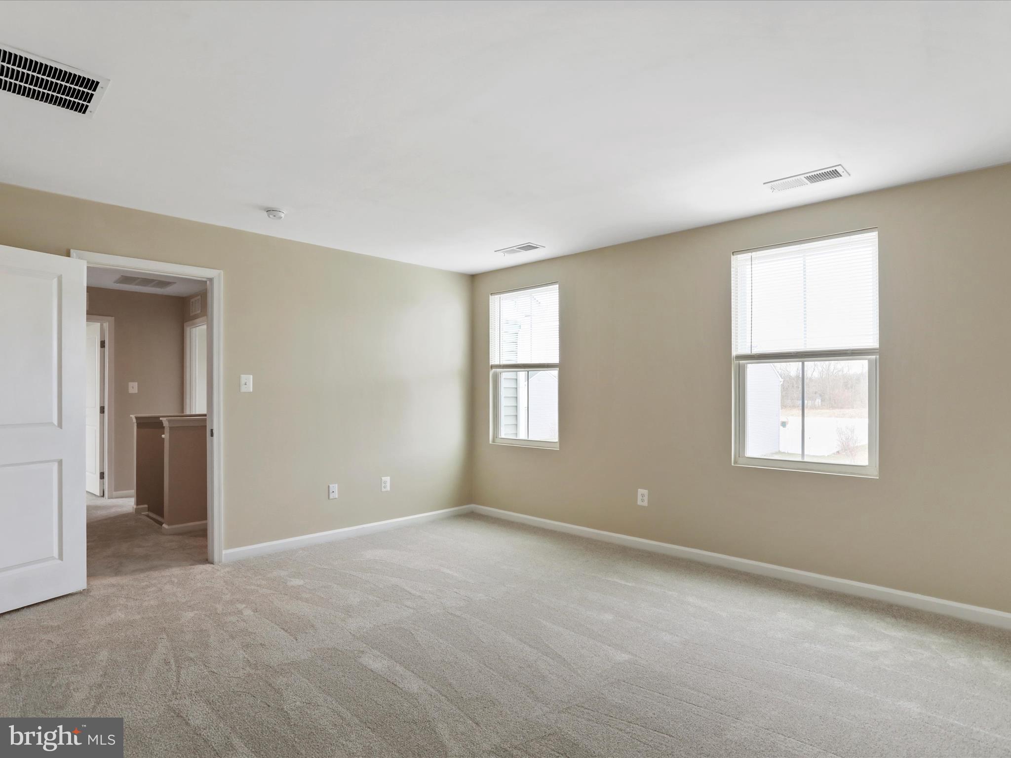257 Switchgrass Court Bunker Hill, WV 25413 - Photo 19 of 26 a view of an empty room with a window
