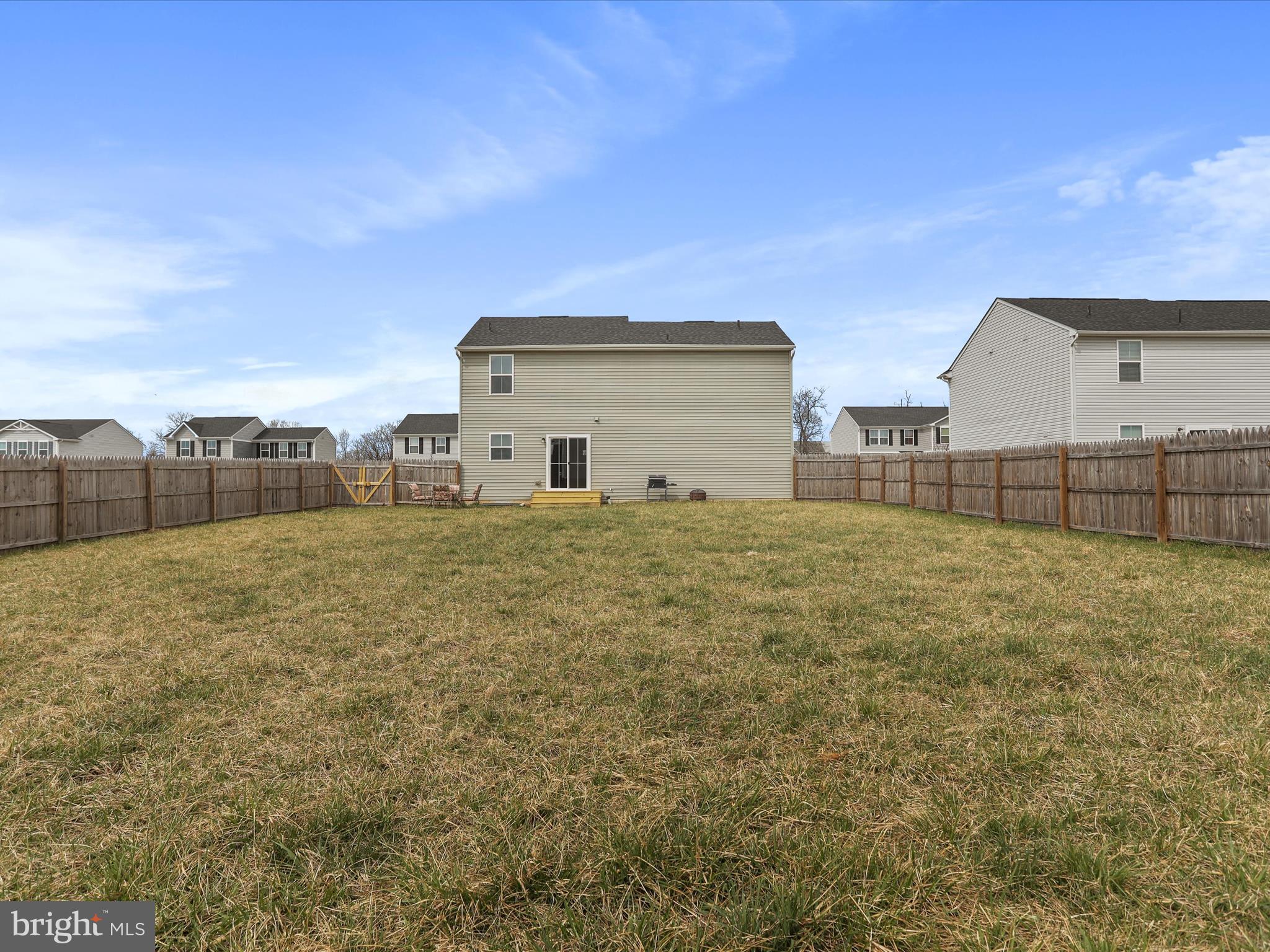 257 Switchgrass Court Bunker Hill, WV 25413 - Photo 25 of 26 a view of a backyard