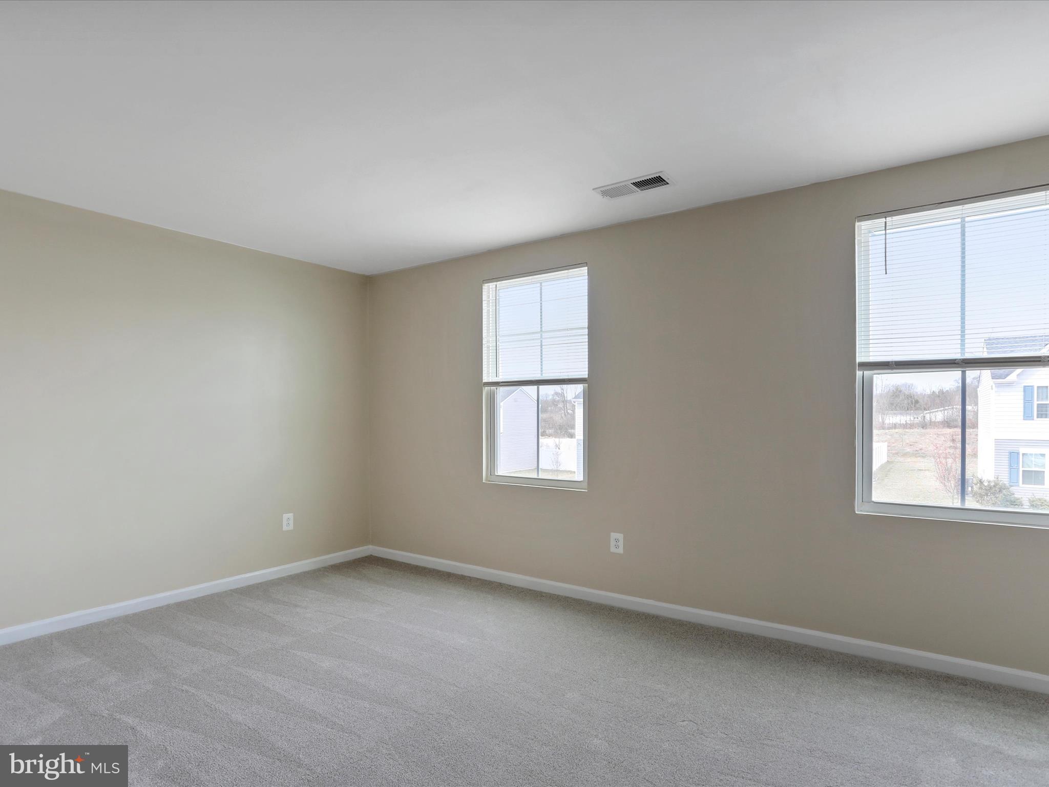 257 Switchgrass Court Bunker Hill, WV 25413 - Photo 10 of 26 an empty room with a window