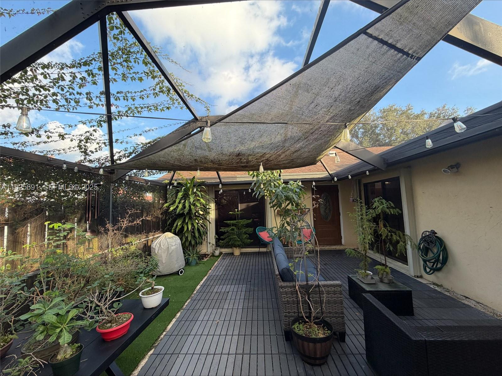 13680 Yarmouth Court, Unit C Wellington, FL 33414 - Photo 20 of 21 a outdoor living space with patio furniture