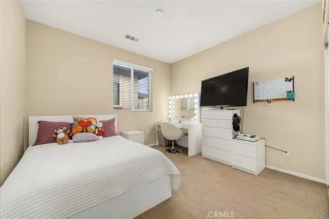 a white bath tub sitting next to a white toilet