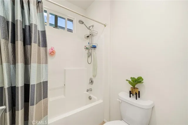 a bathroom with a double vanity sink mirror and shower