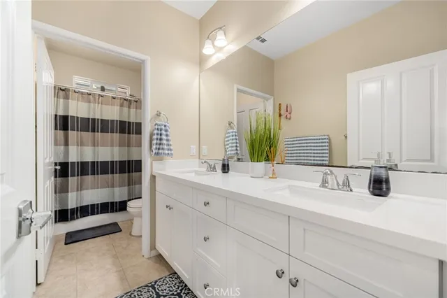 a bedroom with a bed and a closet