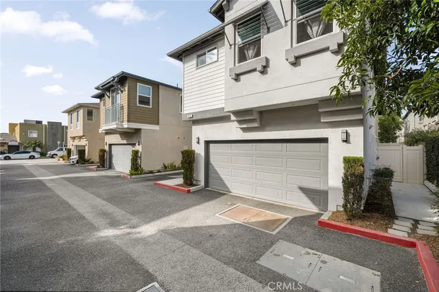 a view of a white house with a outdoor space