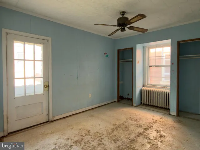 a view of a bathroom from a hallway