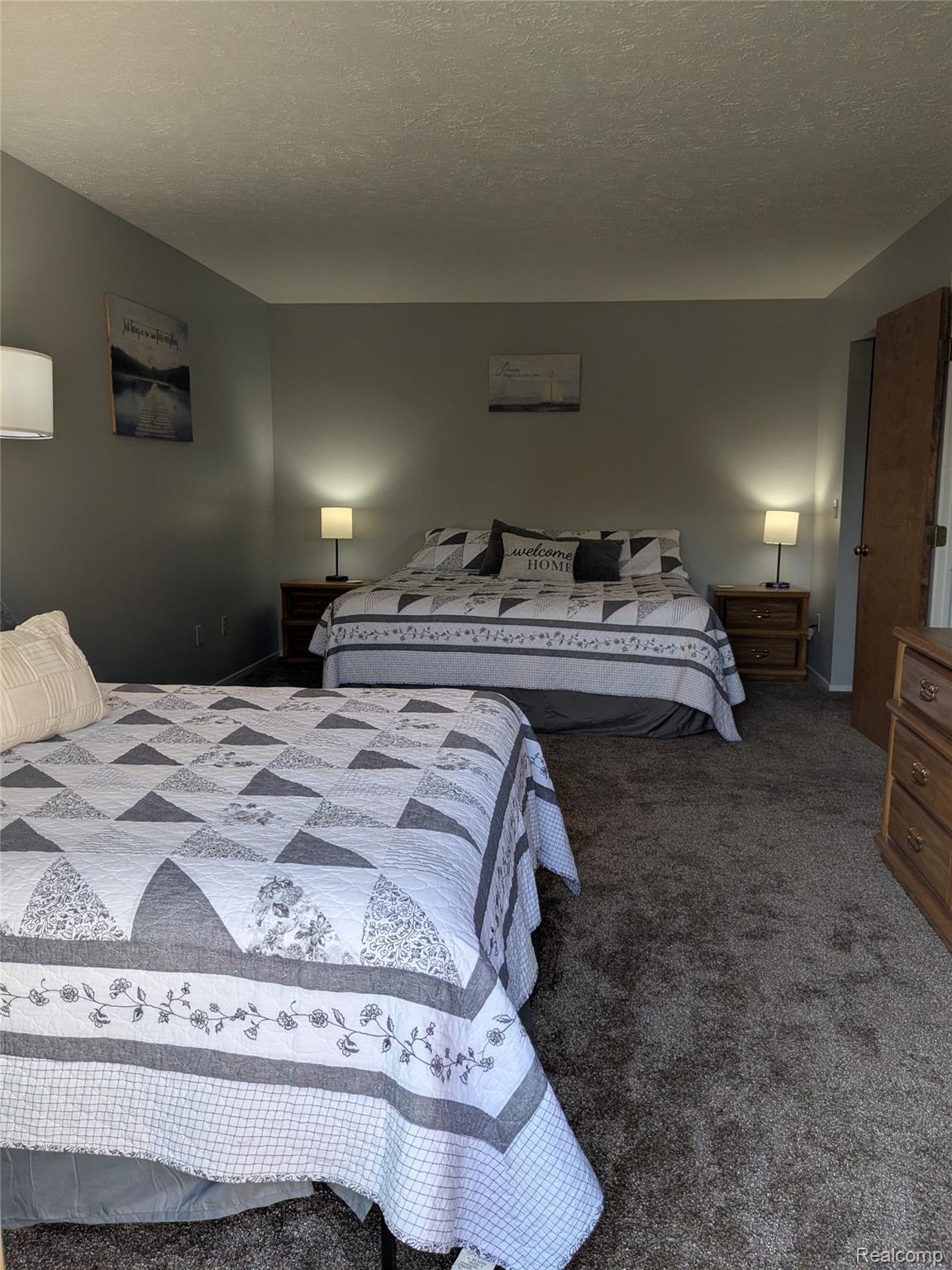 4749 South Pleasantview Road, Unit 20 Harbor Springs, MI 49740 - Photo 21 of 44 Primary Bedroom is So Large, It Currently Contains TWO Beds - One Queen, One King!