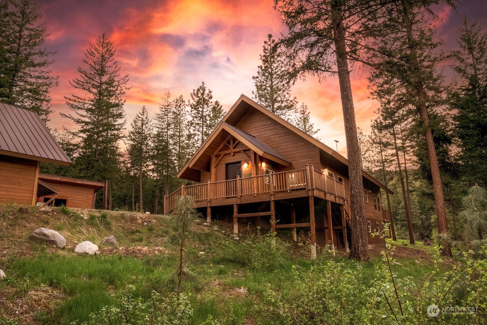 a backyard of a house with table and chairs