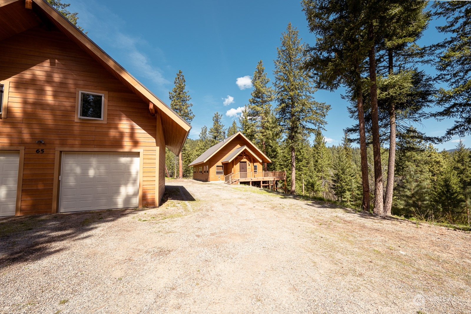 65 Fiddler's Road Winthrop, WA 98862 - Photo 3 of 25 a view of large house with a yard and garage