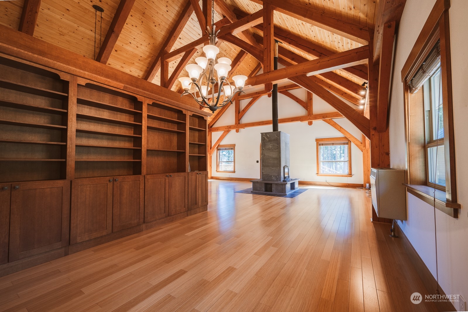 65 Fiddler's Road Winthrop, WA 98862 - Photo 8 of 25 a view of an empty room with wooden floor and a window