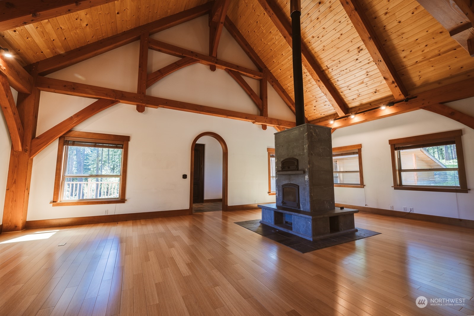 65 Fiddler's Road Winthrop, WA 98862 - Photo 9 of 25 a view of an empty room with wooden floor and a window