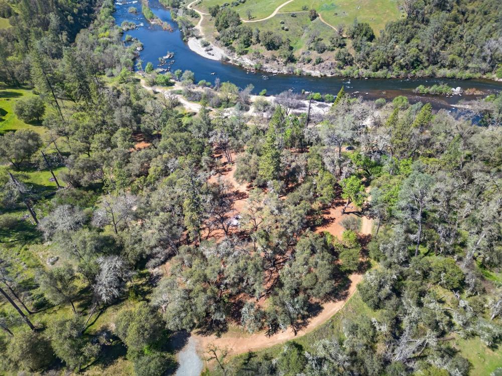 0 Clark Mountain Road Lotus, CA 95651 - Photo 21 of 47 a view of a lake in a forest