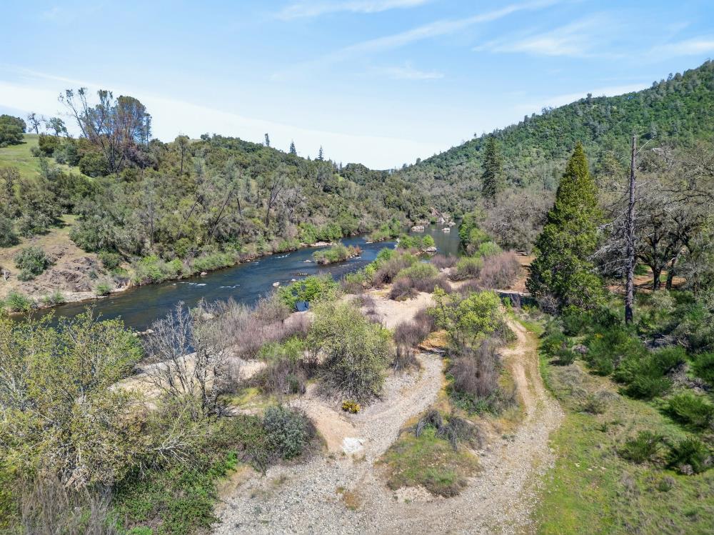 0 Clark Mountain Road Lotus, CA 95651 - Photo 24 of 47 a view of a forest with a lake