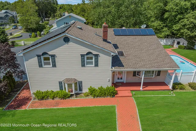 a front view of house with yard and green space